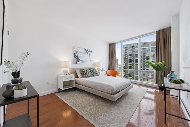 20 Newport Pkwy Unit 2008, Jersey City, NJ 07310 - bedroom with wood-type flooring, floor to ceiling windows, and a view of city