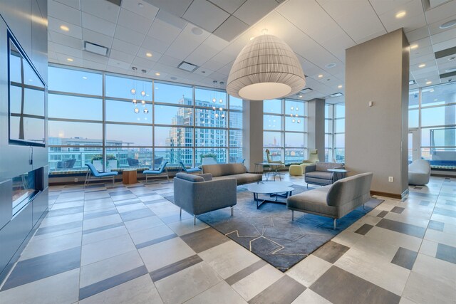 20 Newport Pkwy Unit 2008, Jersey City, NJ 07310 - common area with floor to ceiling windows, a towering ceiling, a view of city, and a drop ceiling