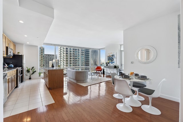 20 Newport Pkwy Unit 2008, Jersey City, NJ 07310 - living room with light wood-type flooring, expansive windows, and recessed lighting