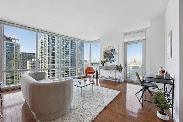 20 Newport Pkwy Unit 2008, Jersey City, NJ 07310 - living room with hardwood / wood-style flooring, a city view, and a wall of windows
