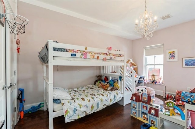 225 8th St, Jersey City, NJ 07302 - bedroom featuring wood finished floors and a chandelier