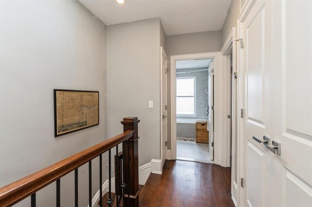 225 8th St, Jersey City, NJ 07302 - hallway featuring dark wood-type flooring and an upstairs landing