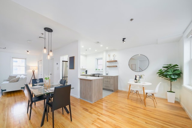 110 Morris St Unit 3R, Jersey City, NJ 07302 - dining space featuring light wood-style floors, healthy amount of natural light, and baseboards