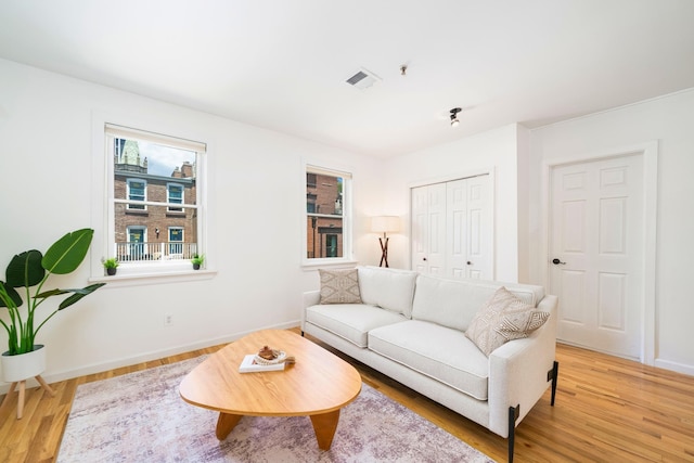 110 Morris St Unit 3R, Jersey City, NJ 07302 - living room featuring light wood finished floors and baseboards