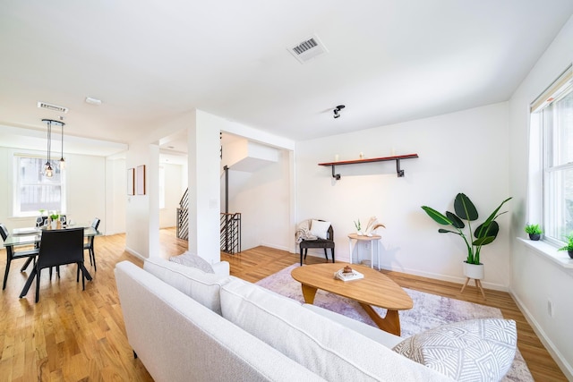 110 Morris St Unit 3R, Jersey City, NJ 07302 - living area featuring light wood-style floors, baseboards, and stairway