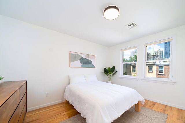 110 Morris St Unit 3R, Jersey City, NJ 07302 - bedroom with light wood-style flooring and baseboards