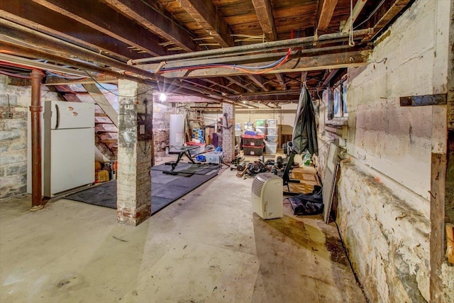 8212 2nd Ave, North Bergen, NJ 07047 - unfinished basement with freestanding refrigerator and water heater
