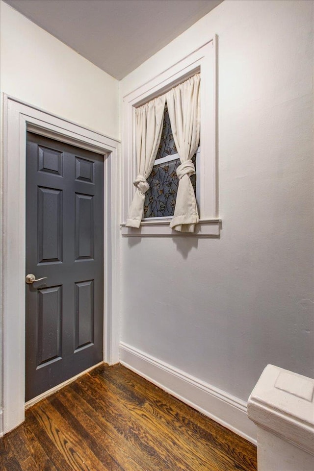 8212 2nd Ave, North Bergen, NJ 07047 - entrance foyer with baseboards and dark wood-style flooring
