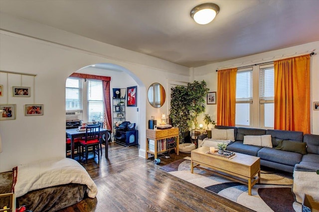 8212 2nd Ave, North Bergen, NJ 07047 - living room featuring arched walkways and dark wood finished floors