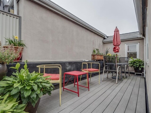 wooden terrace with outdoor dining area