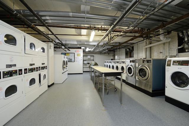 washroom featuring stacked washer and clothes dryer and washer and dryer