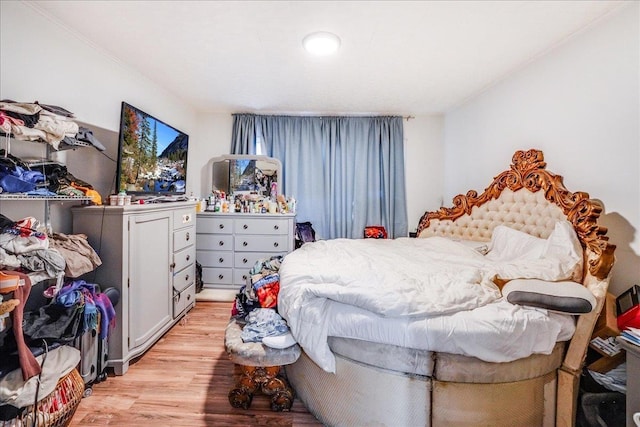 bedroom with light wood-type flooring