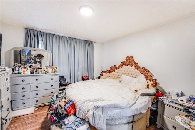 bedroom with light hardwood / wood-style floors