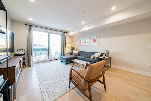 living room featuring light wood-type flooring