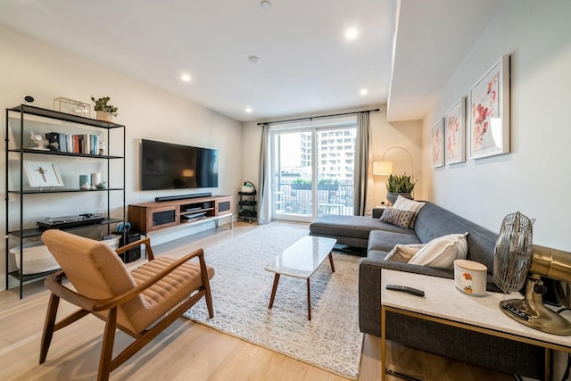 living room with light hardwood / wood-style flooring