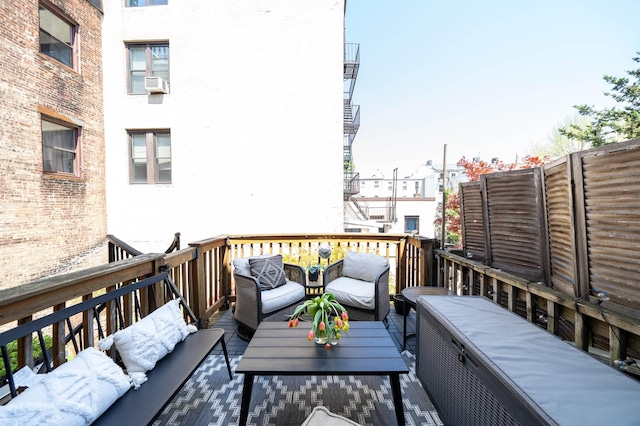 view of wooden balcony with outdoor lounge area and a deck