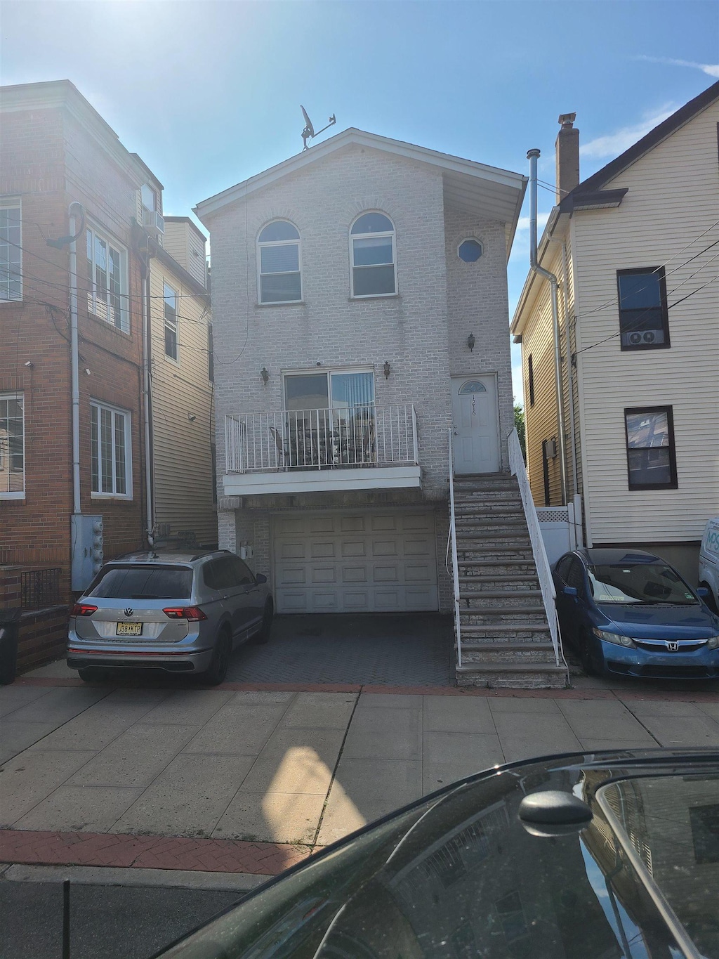 1216 Central Ave, Union City, NJ 07087 - multi unit property with an attached garage, driveway, and brick siding