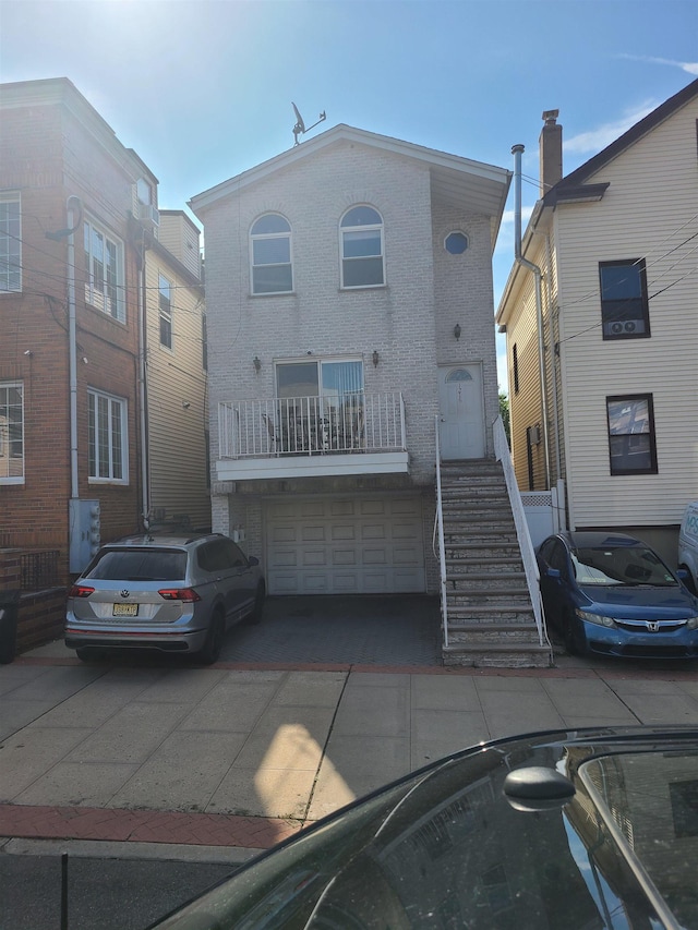 1216 Central Ave, Union City, NJ 07087 - multi unit property with an attached garage, driveway, and brick siding