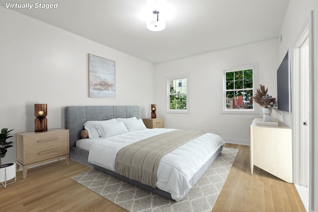 bedroom with light hardwood / wood-style floors