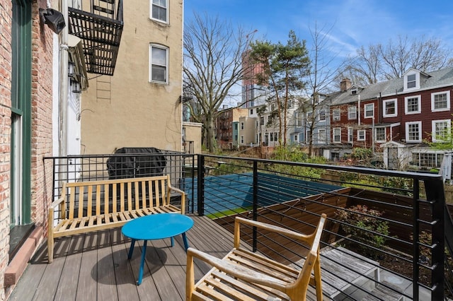 balcony with a residential view and area for grilling