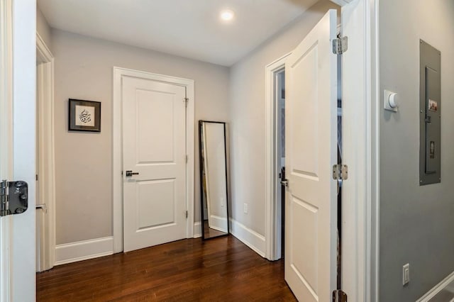 corridor featuring recessed lighting, baseboards, and dark wood-style flooring