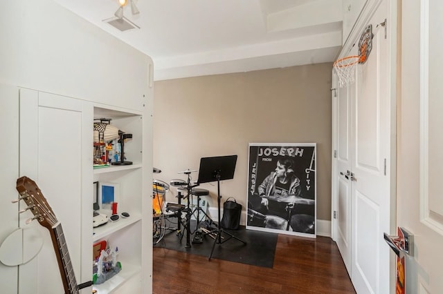 office area with visible vents and wood finished floors