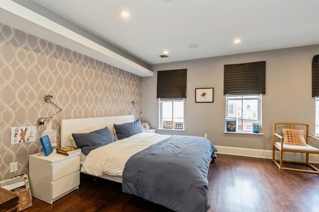 bedroom featuring recessed lighting, baseboards, and dark wood finished floors