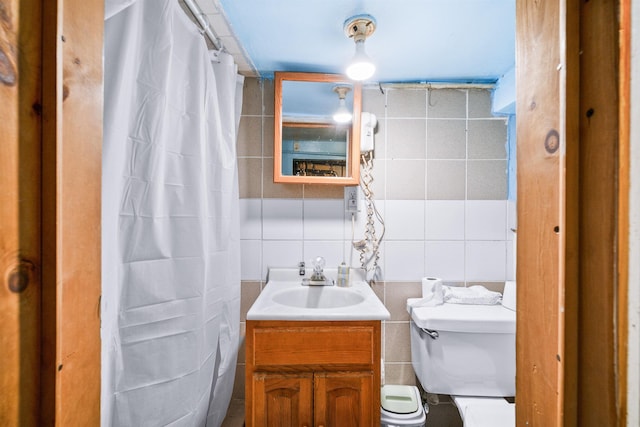 213 45th St, Union City, NJ 07087 - bathroom featuring tile walls, vanity, tasteful backsplash, and a shower with curtain