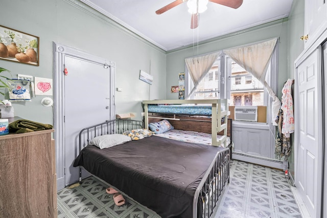 213 45th St, Union City, NJ 07087 - bedroom with cooling unit, crown molding, baseboard heating, ceiling fan, and tile patterned floors