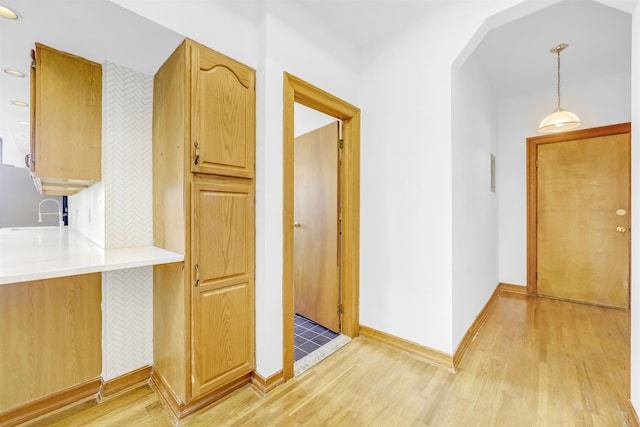 301 79th St Unit E4, North Bergen, NJ 07047 - hall featuring light wood finished floors, a sink, and baseboards