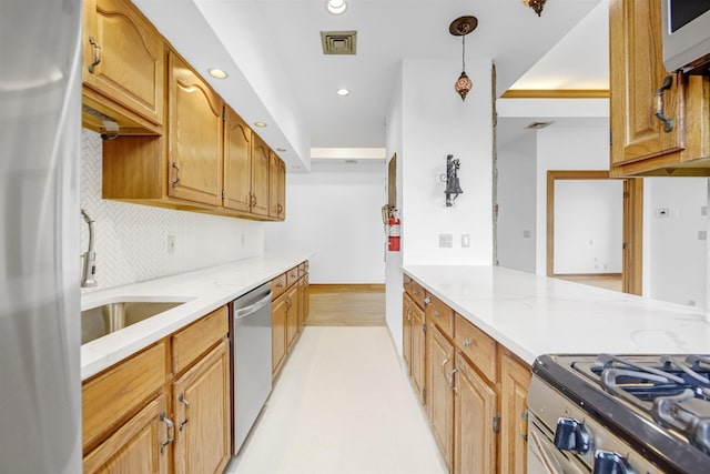 301 79th St Unit E4, North Bergen, NJ 07047 - kitchen with stainless steel appliances, decorative backsplash, recessed lighting, decorative light fixtures, and light stone counters
