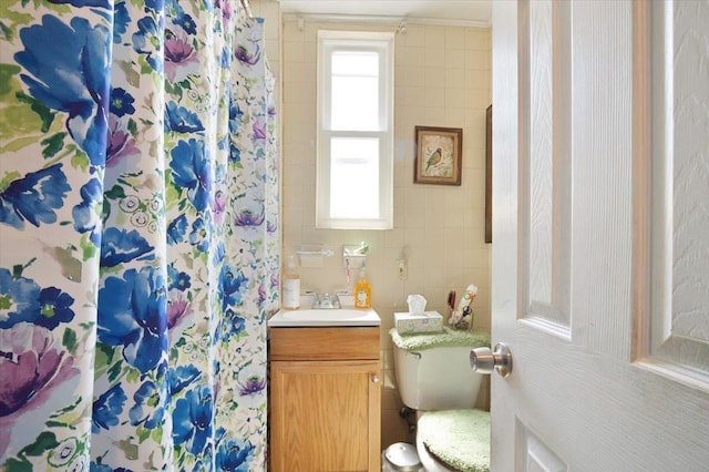 4007 Grand Ave, North Bergen, NJ 07047 - bathroom featuring toilet, a shower with shower curtain, vanity, and tile walls