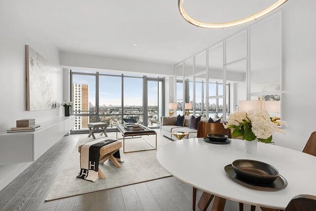 320 Adolphus Ave Unit 909, Cliffside Park, NJ 07010 - dining space featuring plenty of natural light, wood finished floors, and a view of city