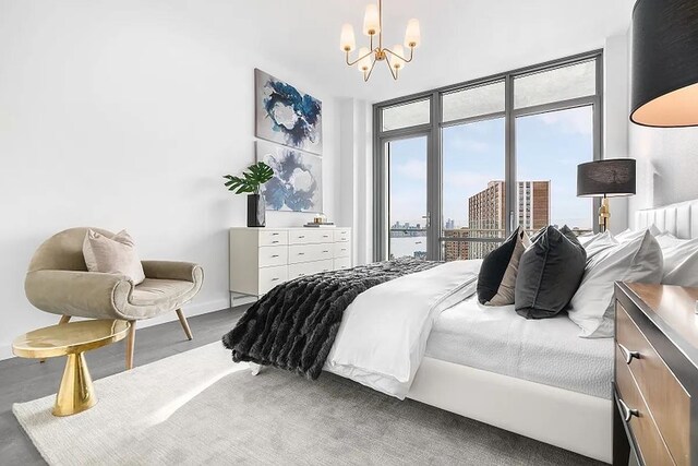 320 Adolphus Ave Unit 909, Cliffside Park, NJ 07010 - bedroom with a chandelier, a view of city, and access to outside