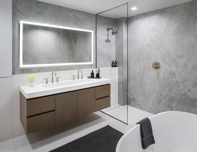 320 Adolphus Ave Unit 909, Cliffside Park, NJ 07010 - full bathroom with walk in shower, double vanity, a soaking tub, and tile walls