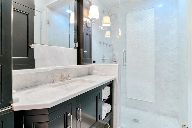 full bathroom featuring vanity, decorative backsplash, and a stall shower