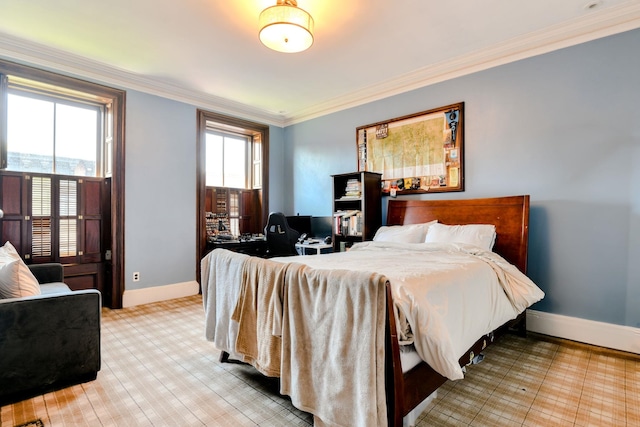 bedroom with baseboards and ornamental molding
