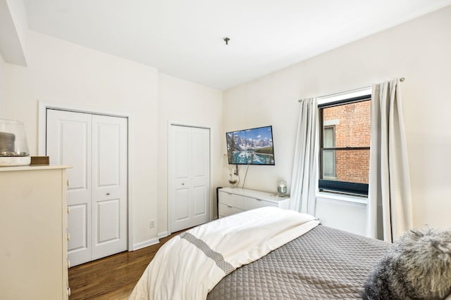 227 Christopher Columbus Dr Unit B-234, Jersey City, NJ 07302 - bedroom featuring wood finished floors and two closets