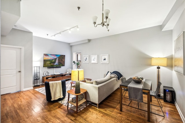 227 Christopher Columbus Dr Unit B-234, Jersey City, NJ 07302 - living room with track lighting, a chandelier, and wood finished floors