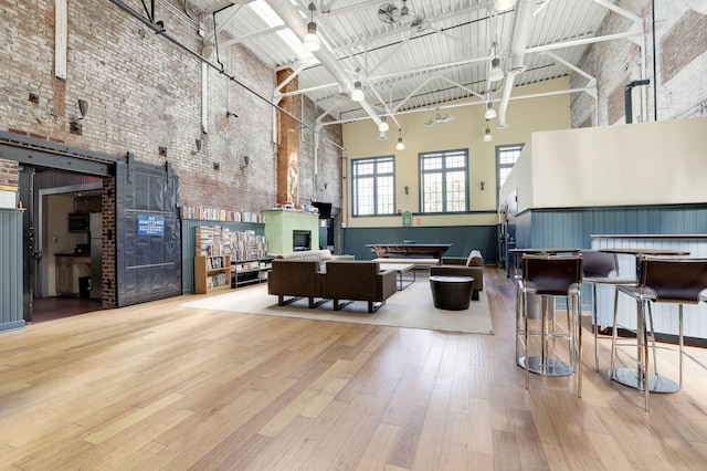 227 Christopher Columbus Dr Unit B-234, Jersey City, NJ 07302 - building lobby with a high ceiling, wainscoting, and brick wall