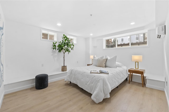 bedroom with recessed lighting, baseboards, and light wood-style flooring