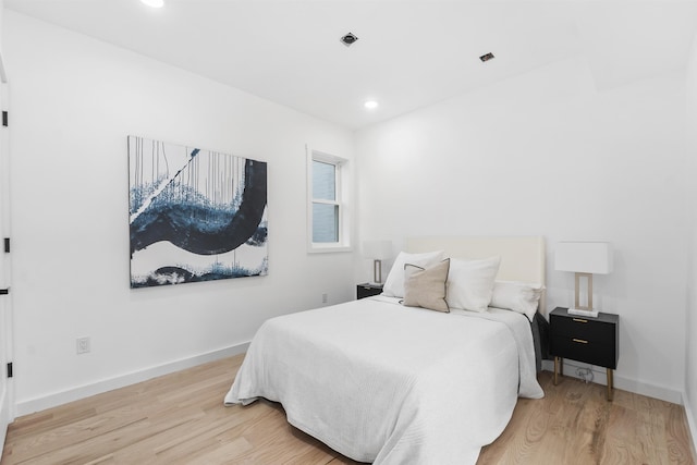 bedroom featuring recessed lighting, baseboards, and wood finished floors