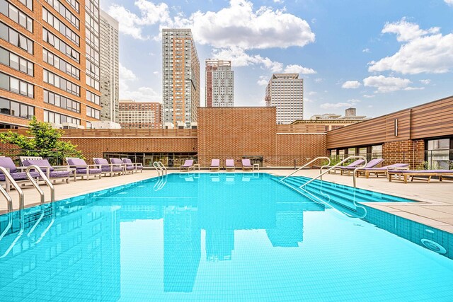 10 Provost St Unit 2405, Jersey City, NJ 07302 - community pool featuring a skyline view