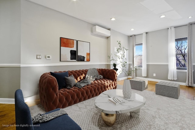 living room with wood-type flooring and a wall unit AC