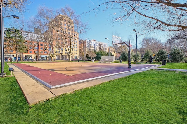 view of basketball court featuring a lawn