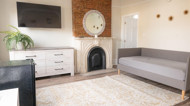 interior space featuring light wood-type flooring and a fireplace
