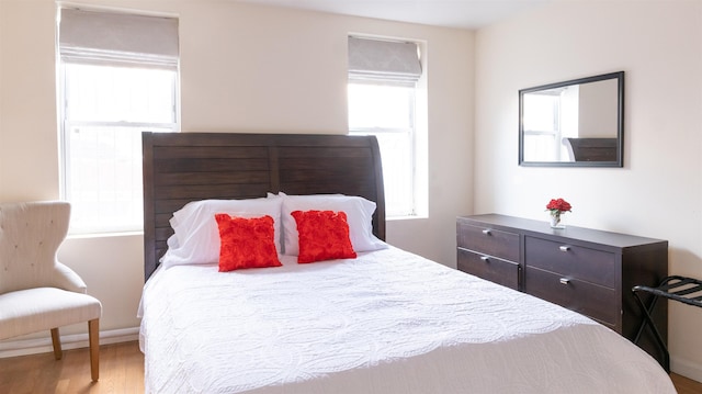 bedroom featuring wood finished floors