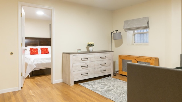 interior space with light wood finished floors and baseboards