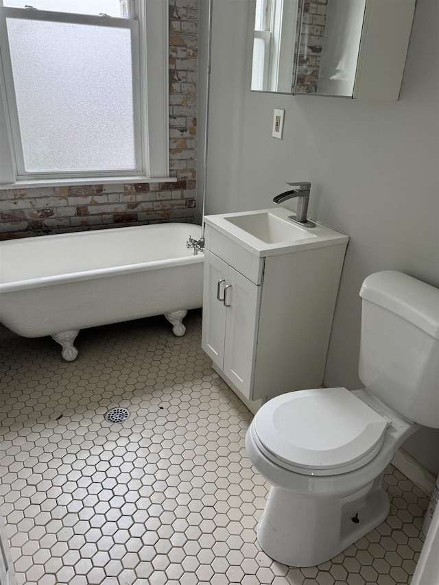 69 Jewett Ave, Jersey City, NJ 07304 - bathroom featuring a freestanding tub, toilet, and vanity