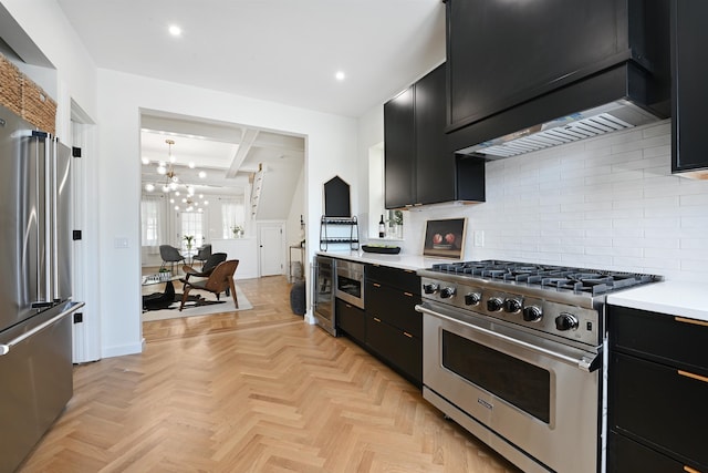 372 Webster Ave, Jersey City, NJ 07307 - kitchen with premium appliances, dark cabinets, a chandelier, and recessed lighting